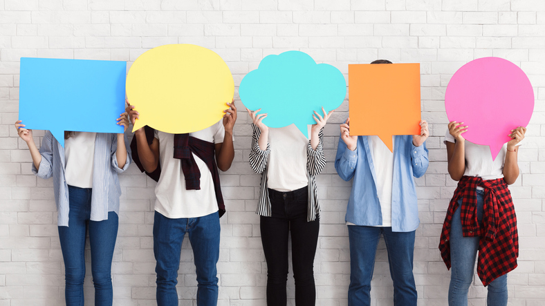 Everyone has own opinion. Teens holding empty speech bubbles